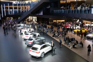 Frankfurt, Germany - September 16, 2015: Visitors viewing a row of new Mercedes-Benz cars at the IAA 2015.